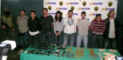 Miss Sinaloa, Laura Zuniga (C), and seven men are presented ...